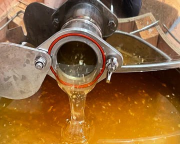 Honey pouring from gate valve